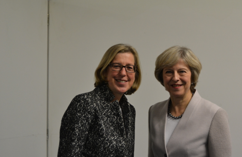 Theresa May and Sarah Newton